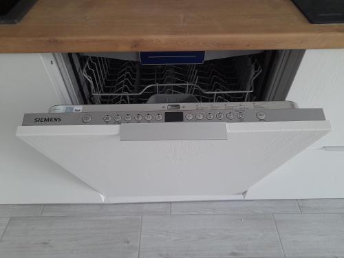 a stove top oven in a kitchen with at Apartments on Meshchanskaya in Odesa