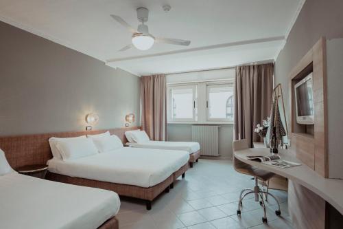 Postel nebo postele na pokoji v ubytování Hotel Marisa