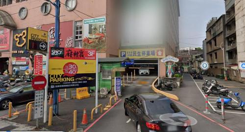 a car parked on a street in a city at Season 5 Inn in Luodong