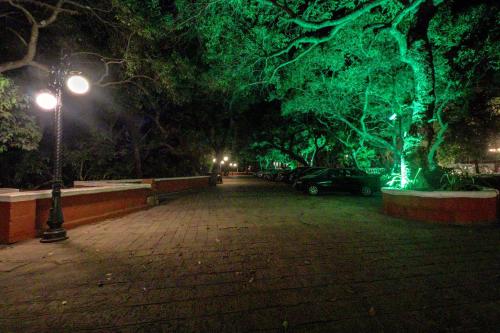 a park at night with trees and a street light at Citrus Chambers Mahabaleshwar in Mahabaleshwar