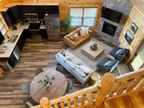 an aerial view of a living room and kitchen in a log cabin at Modern Cabin w Indoor Pool MTN View Game Room in Pigeon Forge