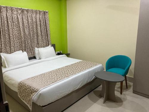 Postel nebo postele na pokoji v ubytování Hotel Divine Inn By WB Inn