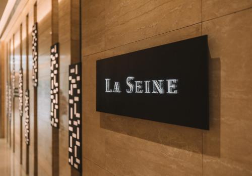 a sign on the wall of a building at LOTTE Hotel Serviced Apartment in Yangon