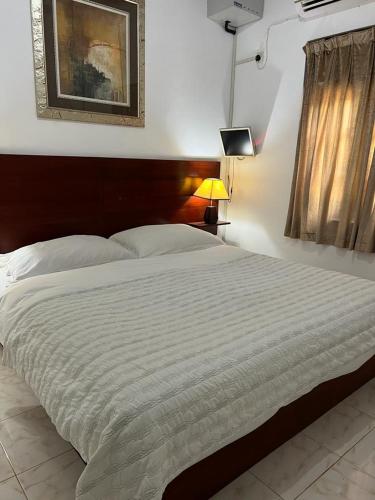 Ένα ή περισσότερα κρεβάτια σε δωμάτιο στο Ransavi villa