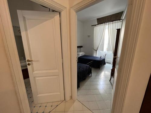 En eller flere senge i et værelse på Antico Palazzo Scala