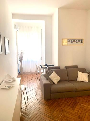 a living room with a couch and a table at Pariolina in Rome