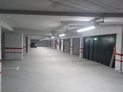 an empty parking garage with a car parked in it at DAMI in Tuzla