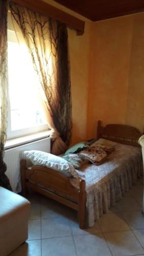 Ένα ή περισσότερα κρεβάτια σε δωμάτιο στο Mama Sofia's house