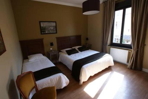 Postel nebo postele na pokoji v ubytování Carcassonne Guesthouse