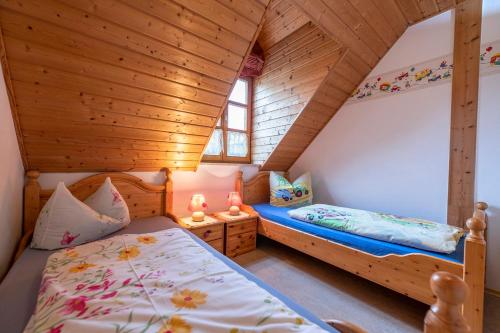 a bedroom with two beds in a attic at Grießlhof in Pleystein