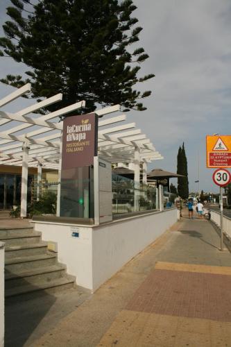 a building with a sign in front of it at Nissi Villa in Ayia Napa