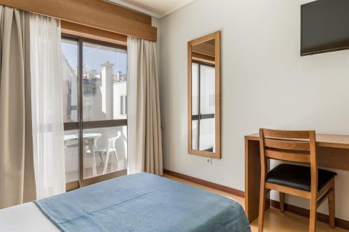 Krevet ili kreveti u jedinici u objektu Hotel Moinho De Vento