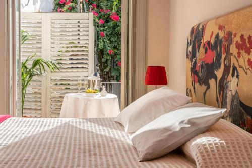 Art Boutique Hotel Chamarelにあるベッド