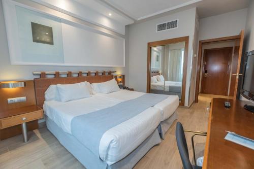 Postel nebo postele na pokoji v ubytování Hotel Olid