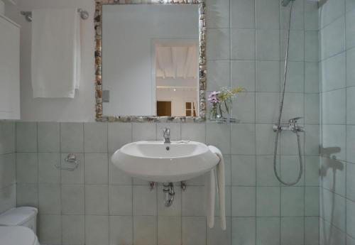 a bathroom with a sink and a mirror at Luxurious Villa Ostria in Elia Beach