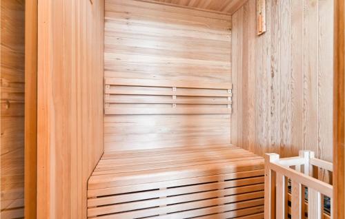 a sauna is shown with a wooden wall at Nice Home In Lovrecan With Sauna in Lovrečan