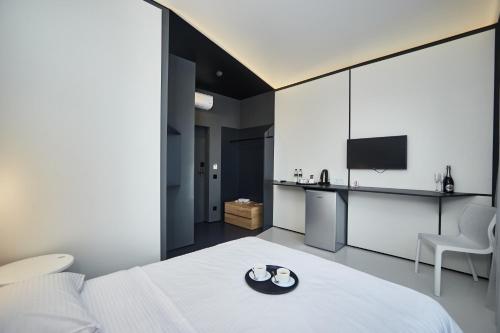 a bedroom with a bed with a plate on it at Sunday Hotel in Odesa