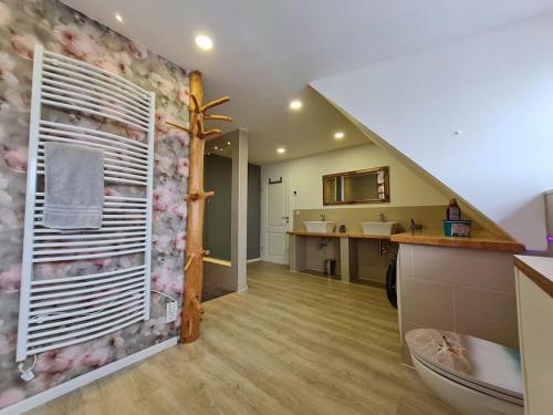 a bathroom with a sink and a toilet in a room at HarzRitter Domizil in Cattenstedt