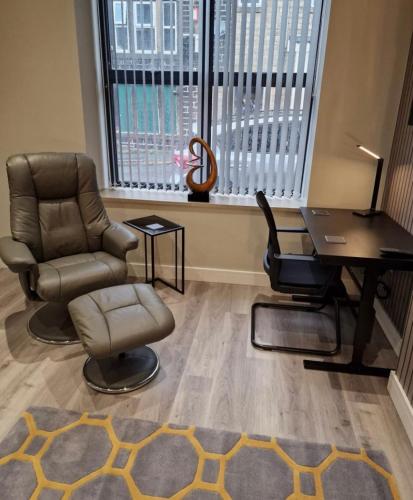 a office with a desk and chair and a desk at Apartment in Uppermill in Saddleworth