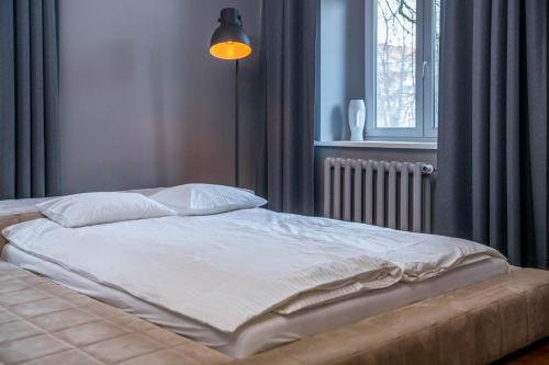 Katil atau katil-katil dalam bilik di AH Apartamenty - Park