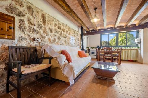 a living room with a couch and a table at Lo paller in Perelló