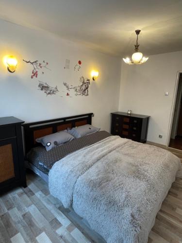 Ένα ή περισσότερα κρεβάτια σε δωμάτιο στο Titan parc home