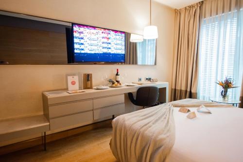 Dosso Dossi Hotels & SPA Downtownにあるベッド