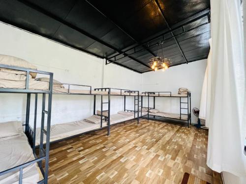 a room with four bunk beds in it at Lacasa home&coffee Mộc Châu in Mộc Châu