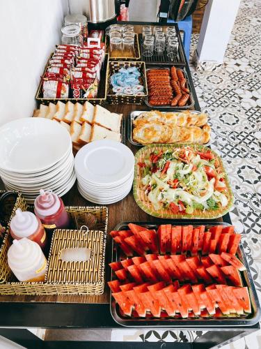 a buffet with many different types of food on a table at Lacasa home&coffee Mộc Châu in Mộc Châu