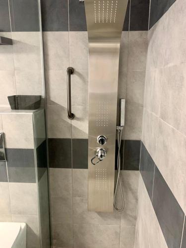 a shower with a glass door in a bathroom at Athens nice apartment in Athens