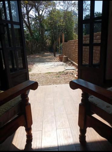 an open door with a view of a yard at casa DON JULIAN in Tepoztlán