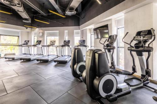 a gym with treadmills and elliptical machines at Atour X Hotel Zhuhai Lover Road Red Wave Bay Beach Seaview in Zhuhai