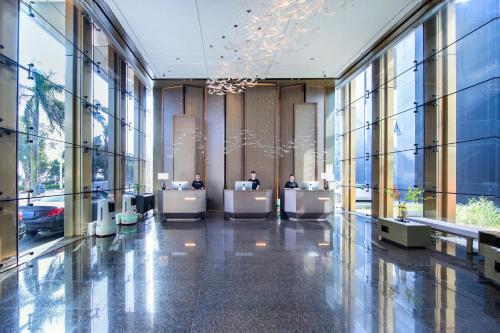 a lobby of a building with people sitting at desks at Atour X Hotel Zhuhai Lover Road Red Wave Bay Beach Seaview in Zhuhai