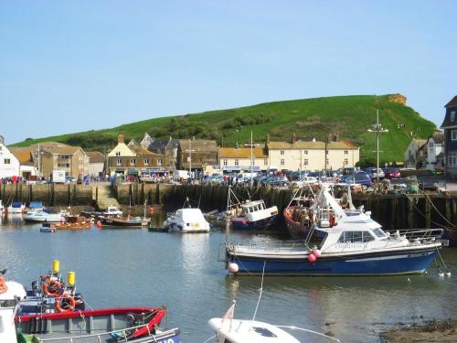 a group of boats are docked in a harbor at Chalet With Sea Views in West Bay