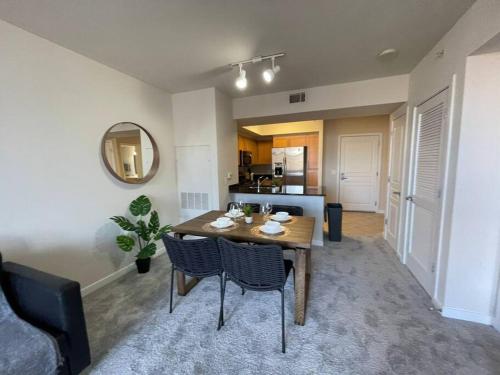 a dining room with a table and chairs in a living room at Beautiful 1 Bedroom Apartment at Pentagon City in Arlington