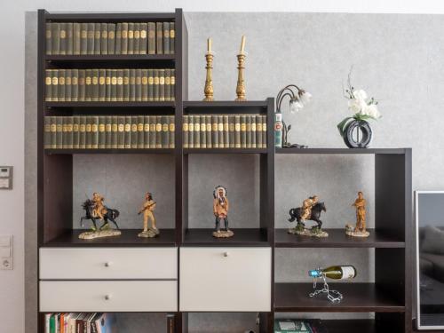 a book shelf with figurines on top of it at 3 Raum FeWo Karl May, gehobene Ausstattung, Radebeul-Ost, 76qm in Radebeul