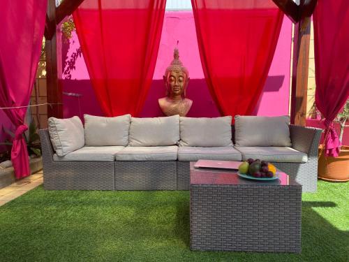 a living room with a couch and a statue at Vila Graciosa - Tranquility Oasis in Lagos