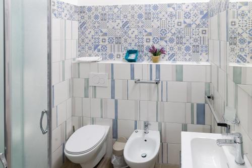 a bathroom with a toilet and a sink at Affittacamere Alessia in Sanremo