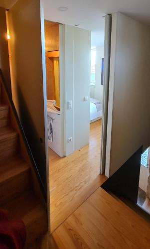 a room with a door open to a bedroom at Casa na Fraga in Aldeia das Dez