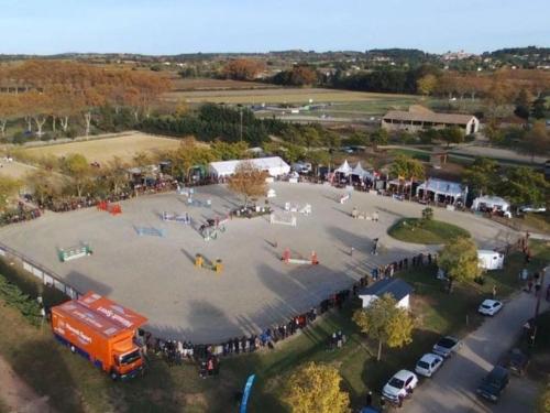a group of people standing around a large parking lot at gite Au Bout du Chemin in Le Pouget