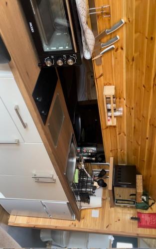 an overhead view of an rv with a desk and aaptop at Hedgehog's Nest in Bathgate