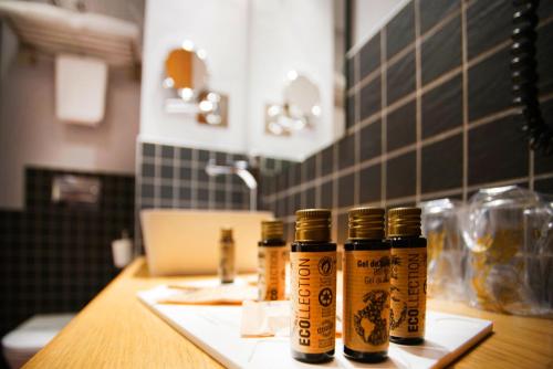 three bottles of spices sitting on a counter in a kitchen at Zenit El Coloquio in Valladolid