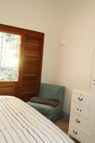 Una cama o camas en una habitación de Gordon Town Kotch