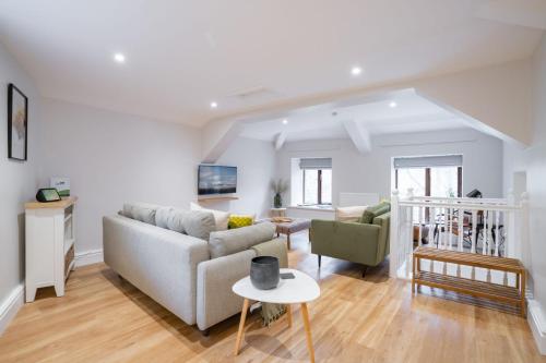 a living room with a couch and a table at Spacious Property with Waterfall View by LetMeStay in Ambleside