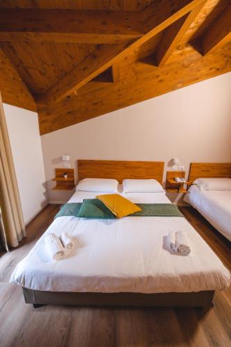 Ένα ή περισσότερα κρεβάτια σε δωμάτιο στο Parco Hotel Granaro