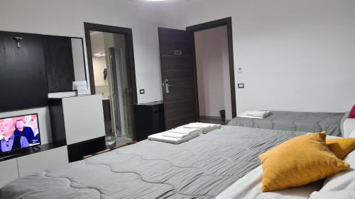 Postel nebo postele na pokoji v ubytování Idilliaco inn