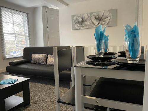 a living room with a table and a couch at Traditional with Views in Wem