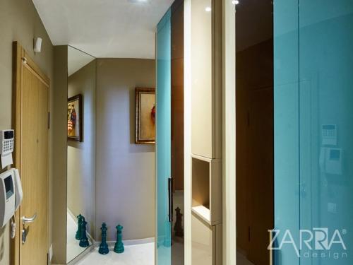 a bathroom with a glass shower with a mirror at Apartment Braila in Plovdiv