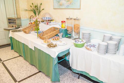 a table with plates and food on top of it at Ana María in Granada