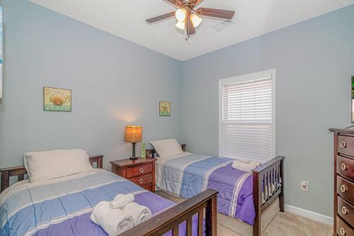 A bed or beds in a room at Barefoot Beach Haven at Barefoot Resort & Golf - 3rd Floor- Close to Everything